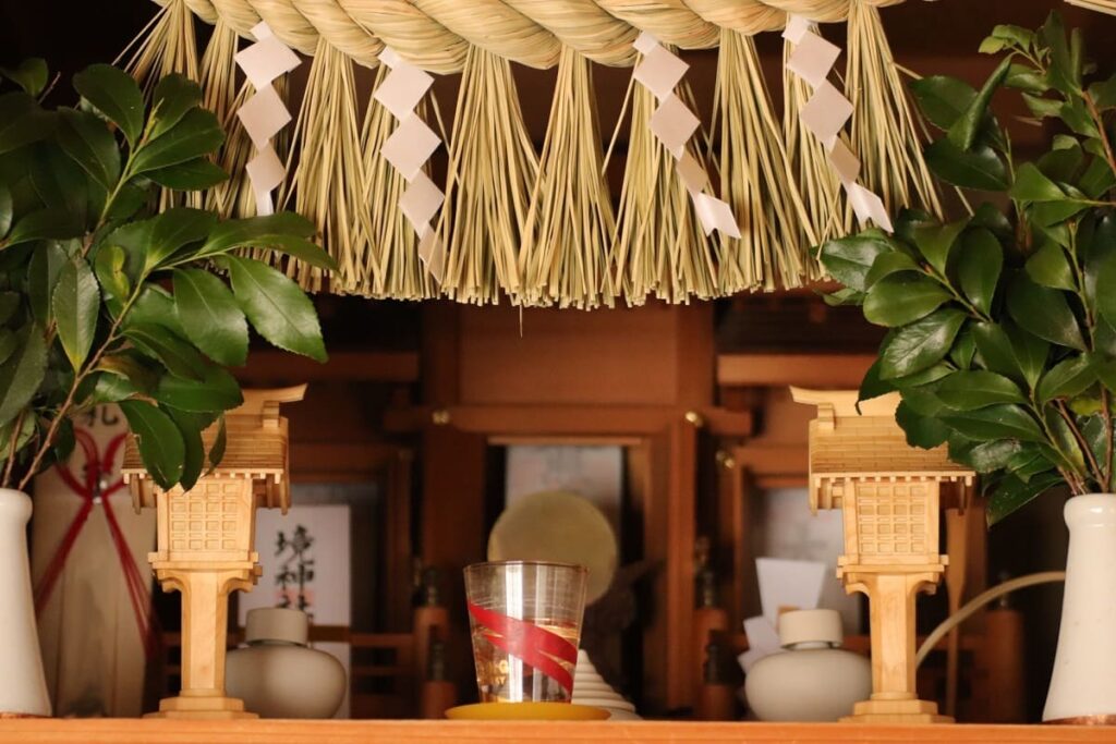 Kamidana home shrine shelf with Shide and Shinto offerings