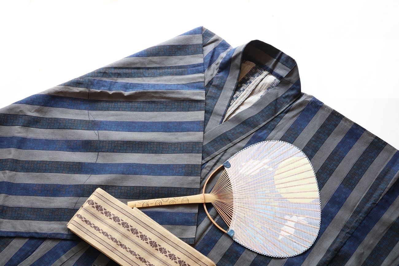 men wearing yukata at Japanese summer festival at night